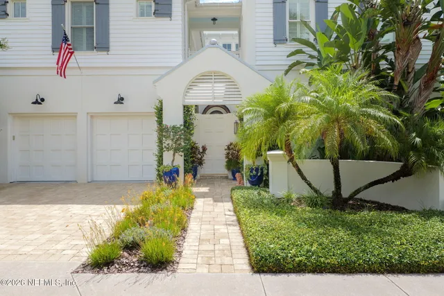 a view of entryway with wooden floor and windows