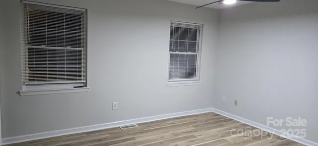 a view of empty room with windows