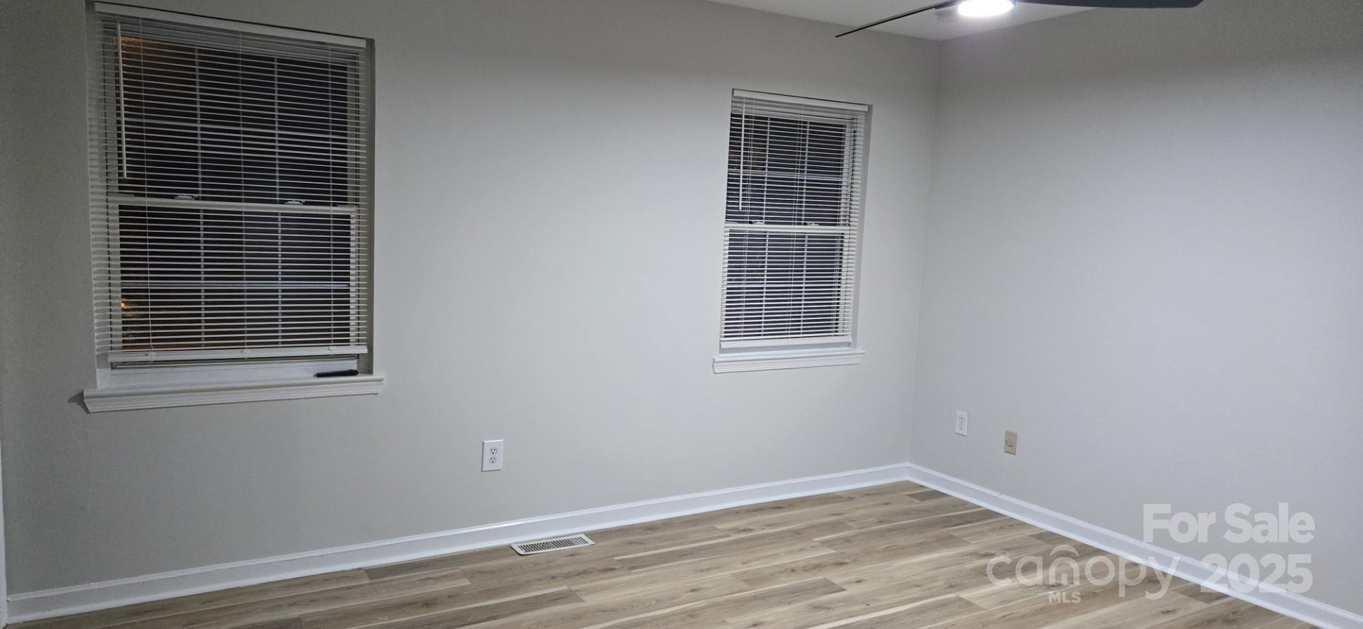 11011 Park Road Charlotte, NC 28226 - Photo 11 of 22 a view of empty room with windows