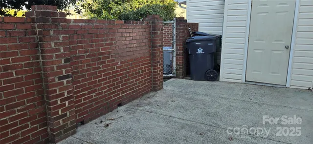 a side view of a house with a yard
