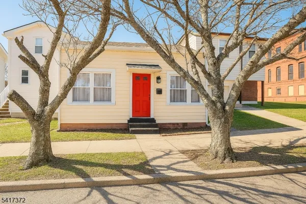 a front view of a house with yard