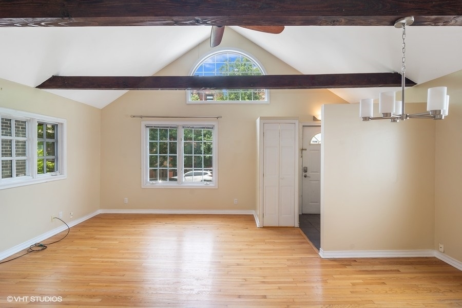 1435 North Mohawk Street, Unit 2 Chicago, IL 60610 - Photo 3 of 6 a view of a room with wooden floor and windows