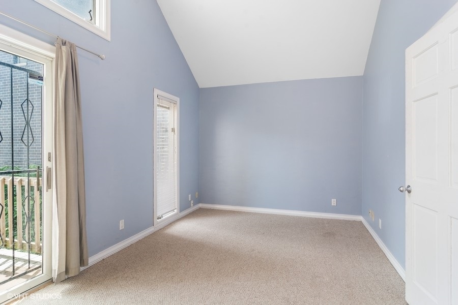 1435 North Mohawk Street, Unit 2 Chicago, IL 60610 - Photo 4 of 6 an empty room with windows