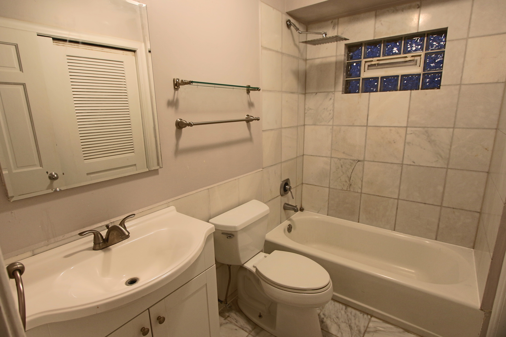1435 North Mohawk Street, Unit 2 Chicago, IL 60610 - Photo 5 of 6 a bathroom with a sink toilet and shower