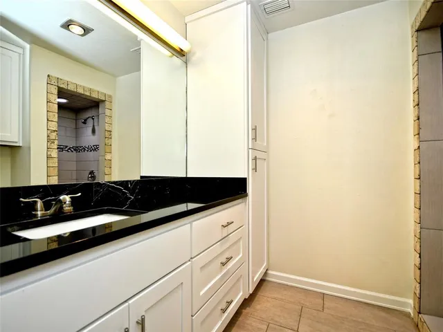 a close view of a sink and a mirror