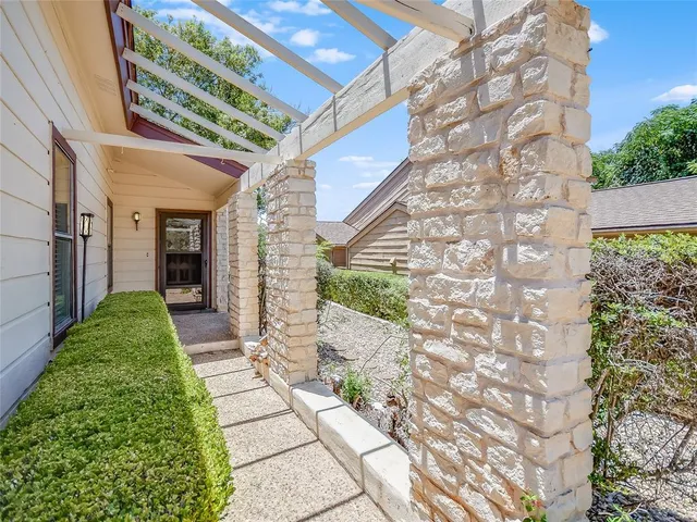 a view of a pathway both side of house