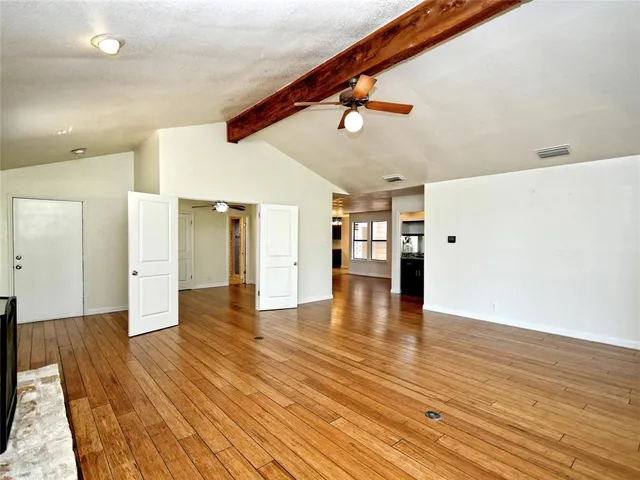 a view of a livingroom with wooden floor