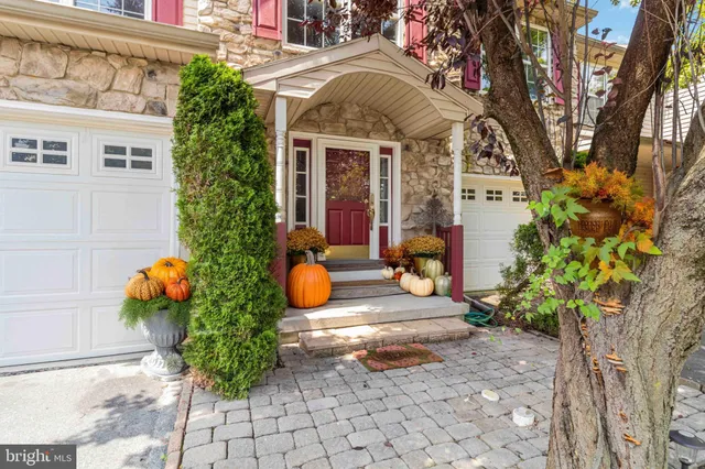 a front view of a house with an outdoor seating