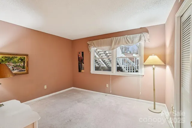 a room with furniture and lamp