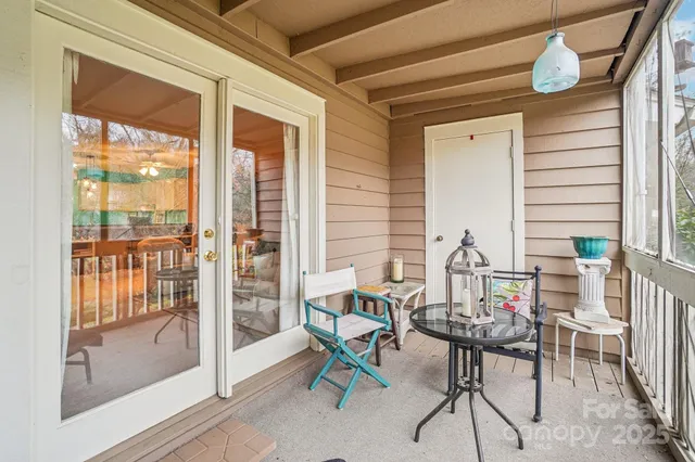 a view of a two chairs in the balcony