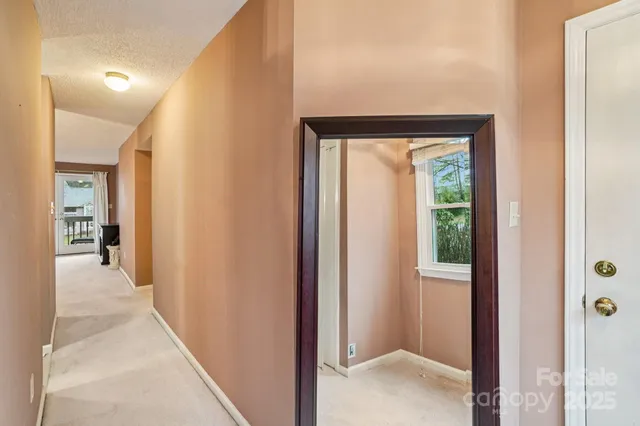 a view of a hallway with a glass door