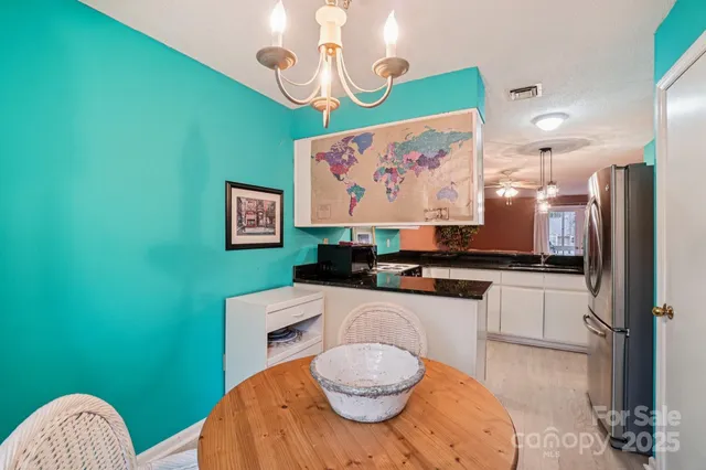 a kitchen with a table and chairs