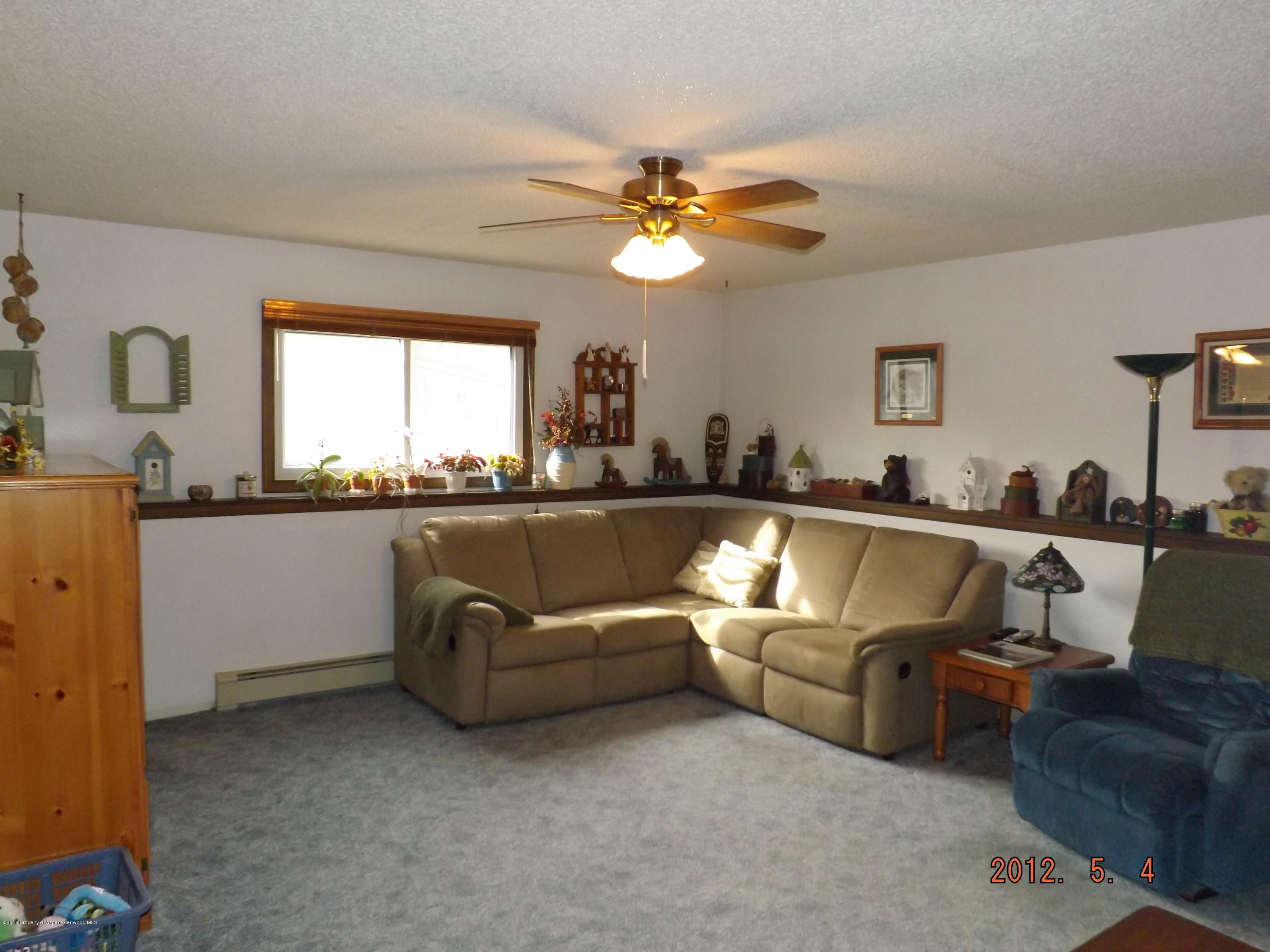 515 East 12th Street Rifle, CO 81650 - Photo 16 of 39 a living room with furniture and a large window