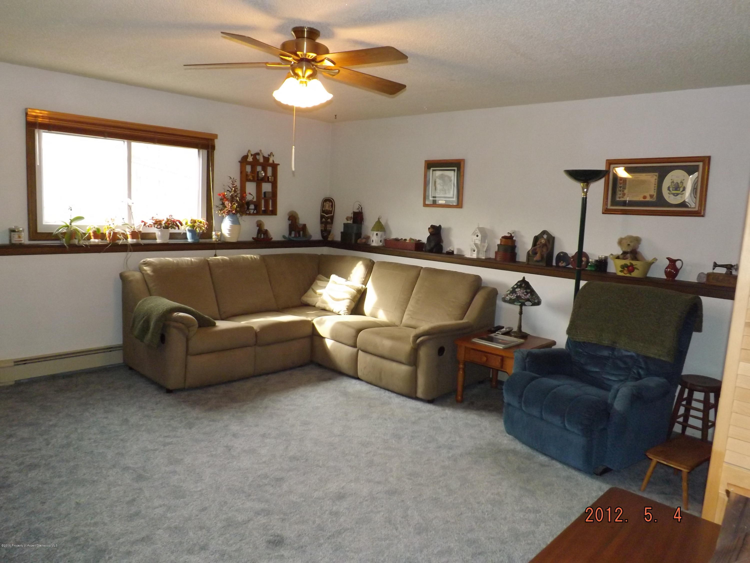 515 East 12th Street Rifle, CO 81650 - Photo 17 of 39 a living room with furniture and a large window