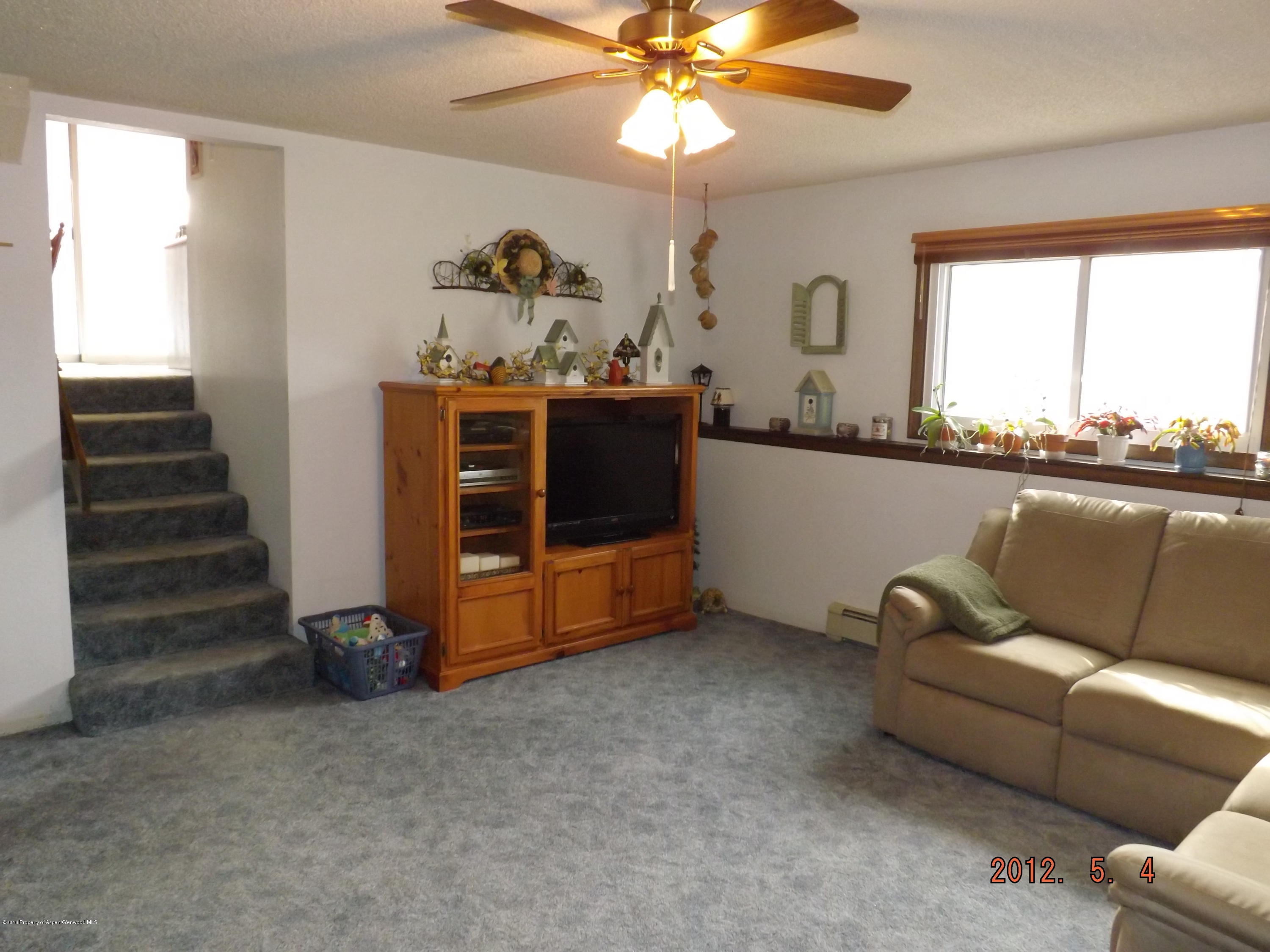 515 East 12th Street Rifle, CO 81650 - Photo 18 of 39 a living room with furniture and a window
