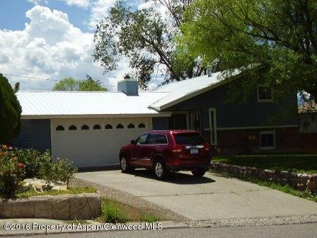 515 East 12th Street Rifle, CO 81650 - Photo 2 of 39 a view of a house with a yard