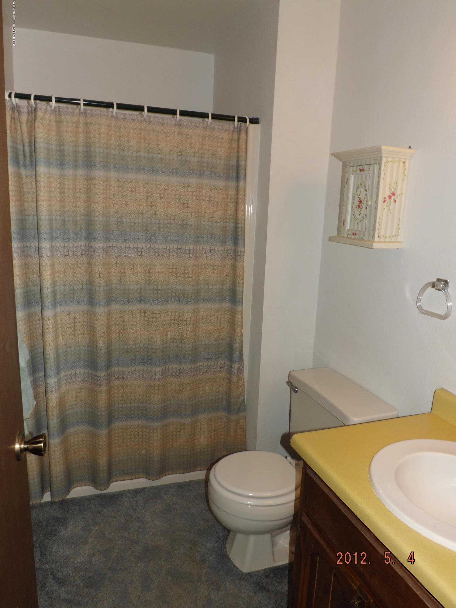 515 East 12th Street Rifle, CO 81650 - Photo 33 of 39 a bathroom with a sink and toilet
