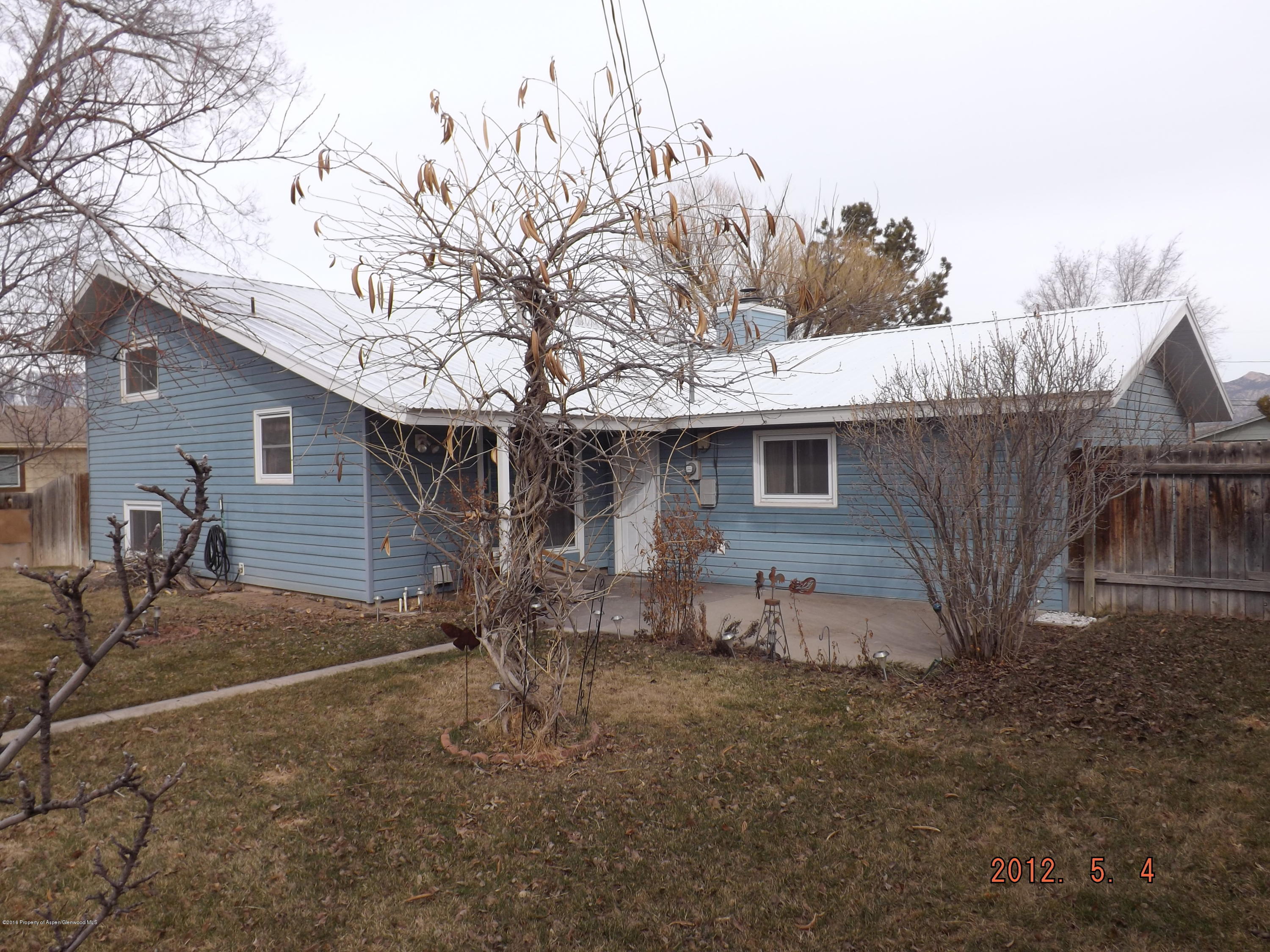 515 East 12th Street Rifle, CO 81650 - Photo 35 of 39 a view of a house with a yard and garage