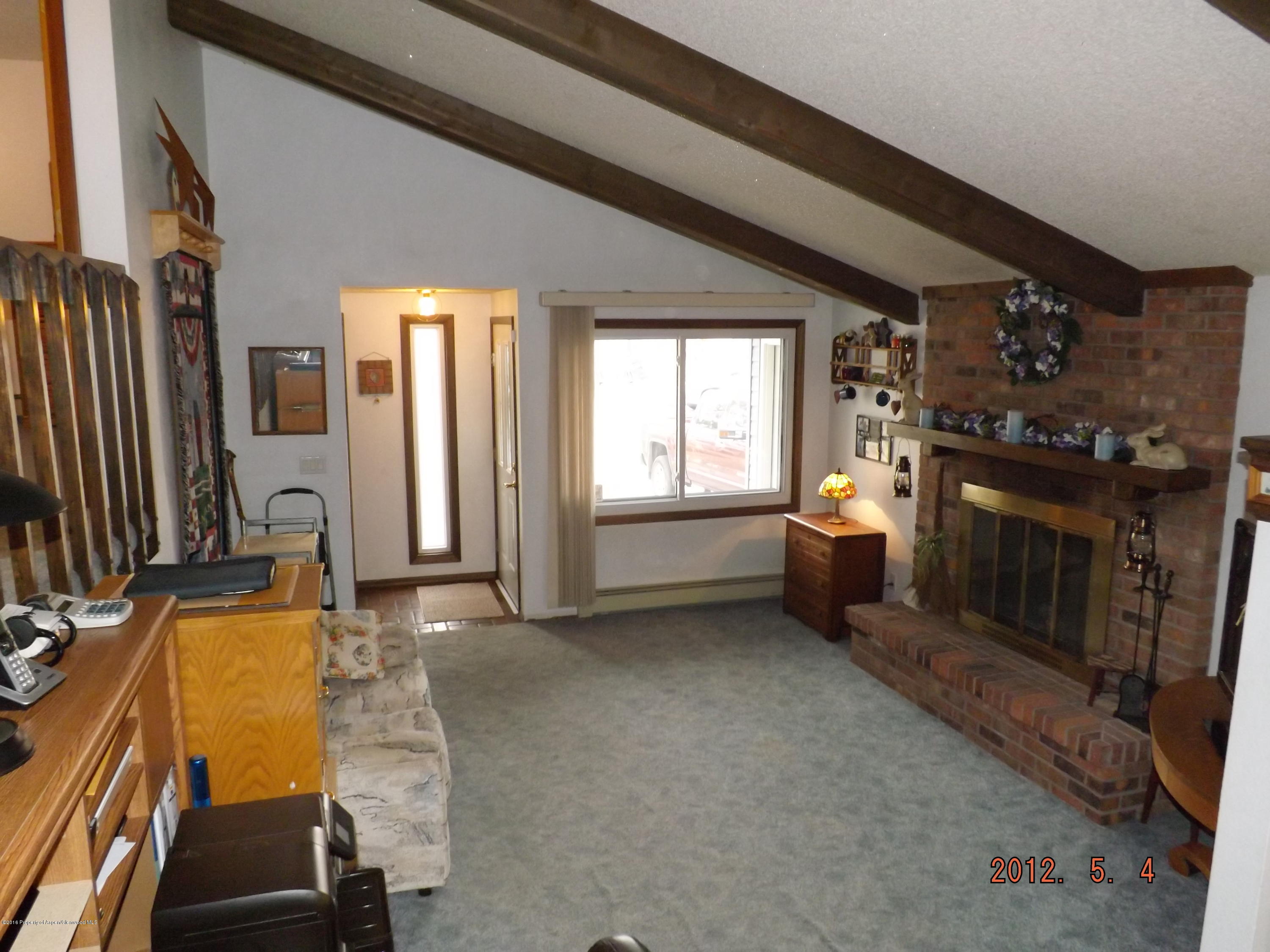515 East 12th Street Rifle, CO 81650 - Photo 7 of 39 a view of a livingroom with furniture and a kitchen