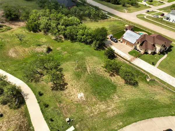 a view of a lake with a yard