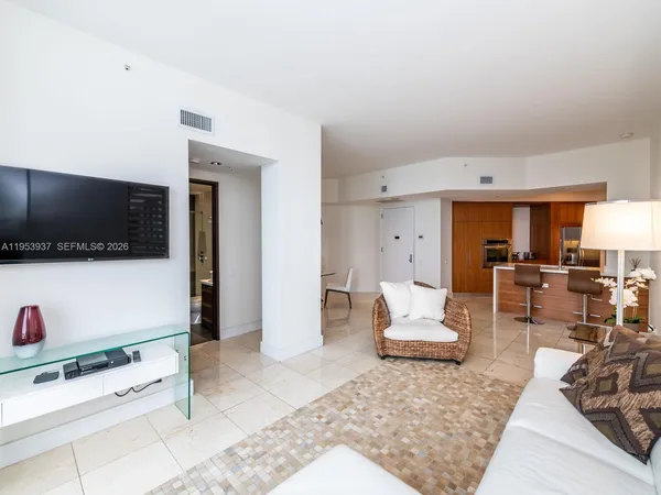 a kitchen with a sink and a refrigerator