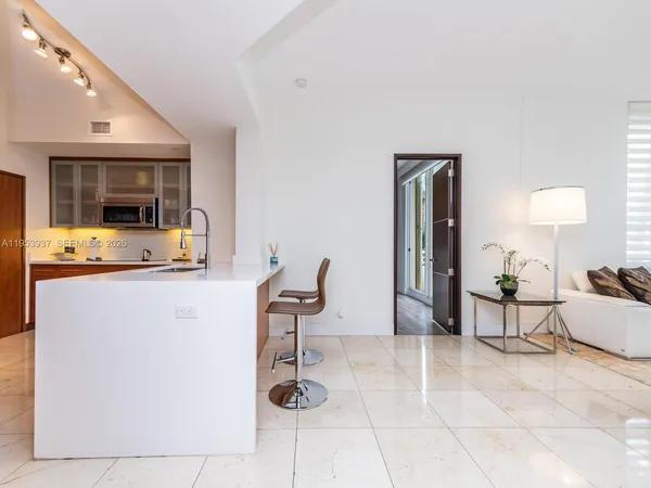 a kitchen with a sink stove and microwave