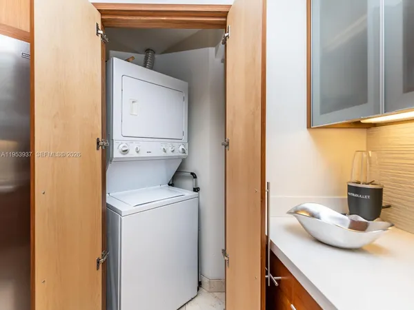 a bathroom with a toilet sink and shower