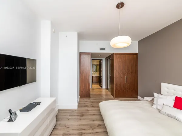 a room with gym equipment and lots of tables