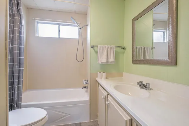 a bathroom with a sink a toilet and a bathtub