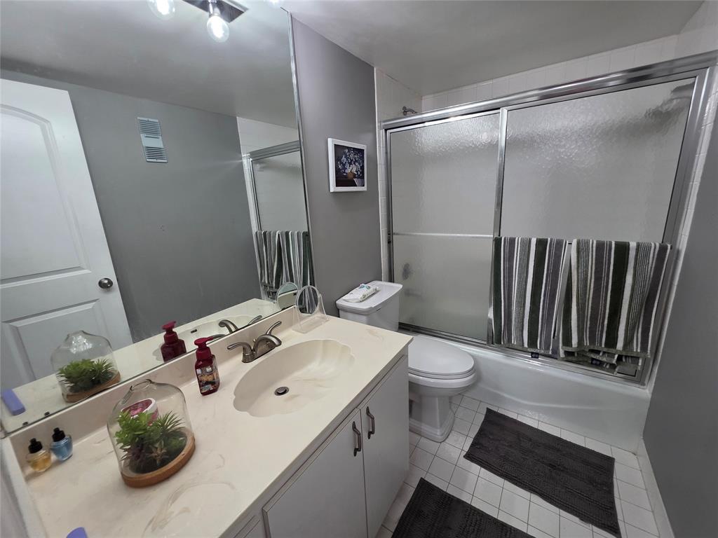 3940 Inverrary Boulevard, Unit 507A Fort Lauderdale, FL 33319 - Photo 12 of 35 a bathroom with a sink toilet and shower
