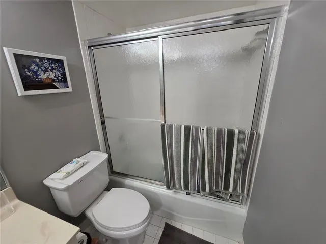 a bedroom with bed and window