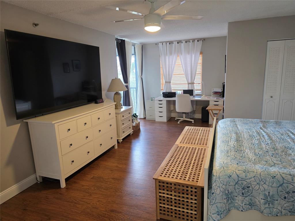 3940 Inverrary Boulevard, Unit 507A Fort Lauderdale, FL 33319 - Photo 18 of 35 a living room with furniture and a flat screen tv