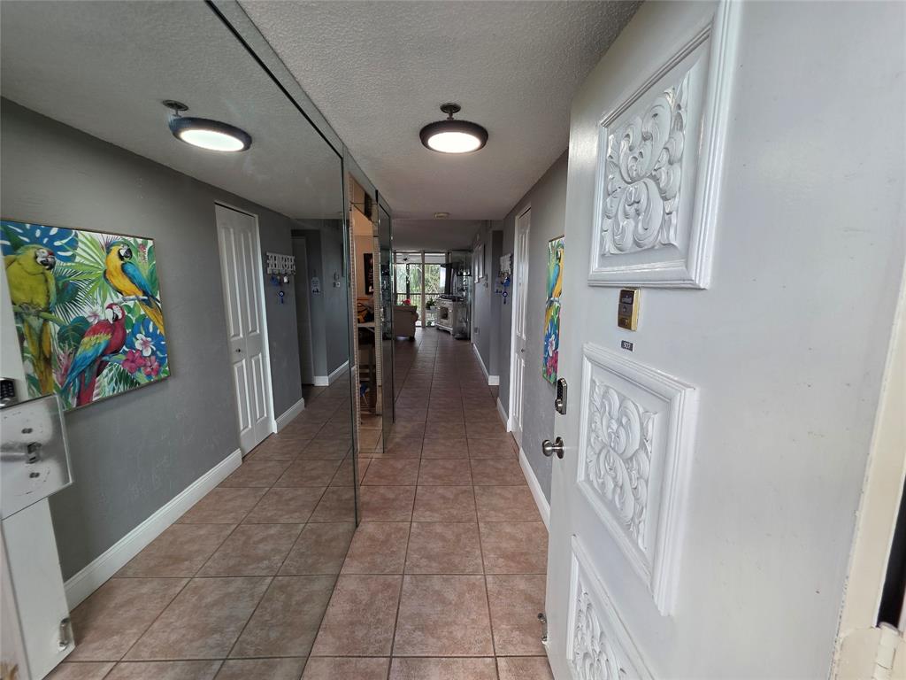 3940 Inverrary Boulevard, Unit 507A Fort Lauderdale, FL 33319 - Photo 2 of 35 a view of a hallway with windows