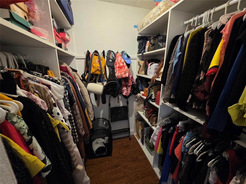 3940 Inverrary Boulevard, Unit 507A Fort Lauderdale, FL 33319 - Photo 23 of 35 a view of walk in closet with clothes and shoes