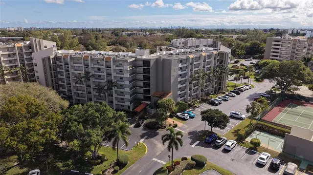 a view of a tall building in the backyard