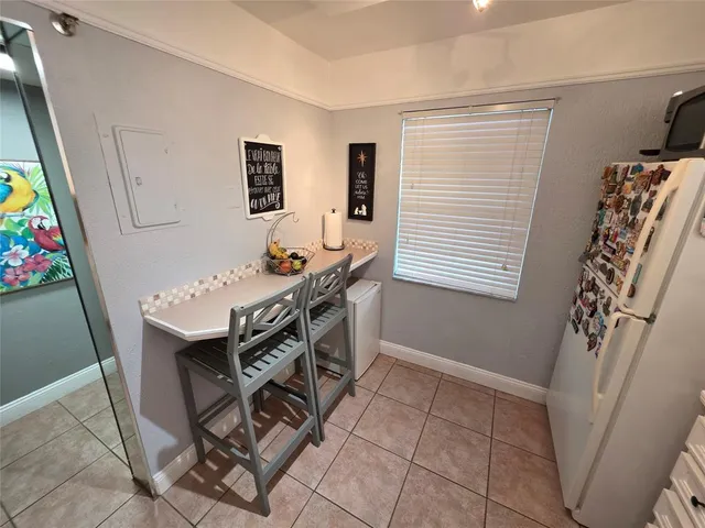 a view of a living room and floor to ceiling window or couch