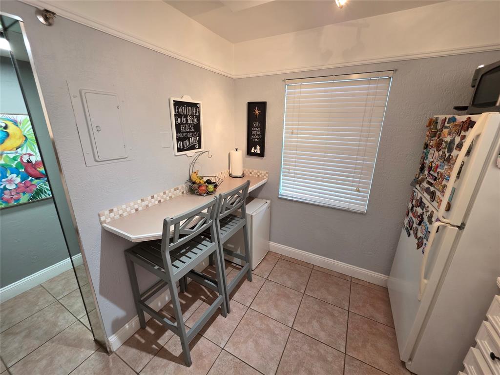 3940 Inverrary Boulevard, Unit 507A Fort Lauderdale, FL 33319 - Photo 6 of 35 a view of a workspace with furniture and a window