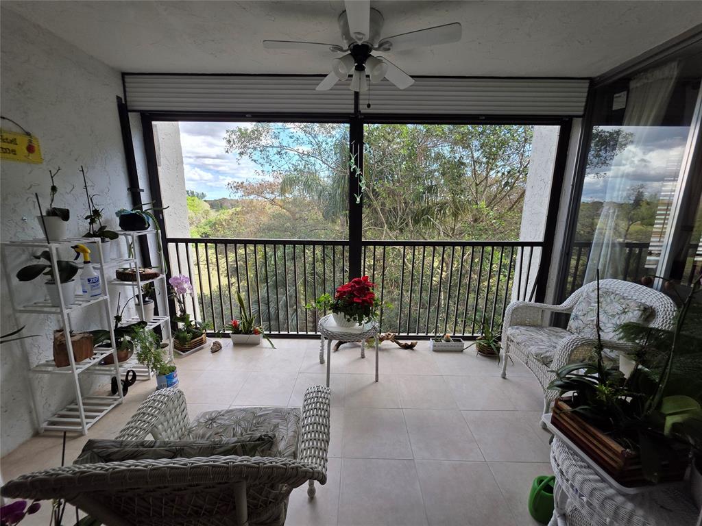 3940 Inverrary Boulevard, Unit 507A Fort Lauderdale, FL 33319 - Photo 8 of 35 a view of a living room and floor to ceiling window or couch