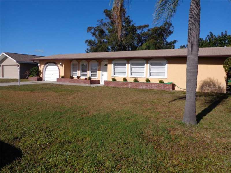 120 Caddy Road Rotonda West, FL 33947 - Photo 1 of 1 Facade/Exterior Front - Bright and cheery entrance into large spruced up home.