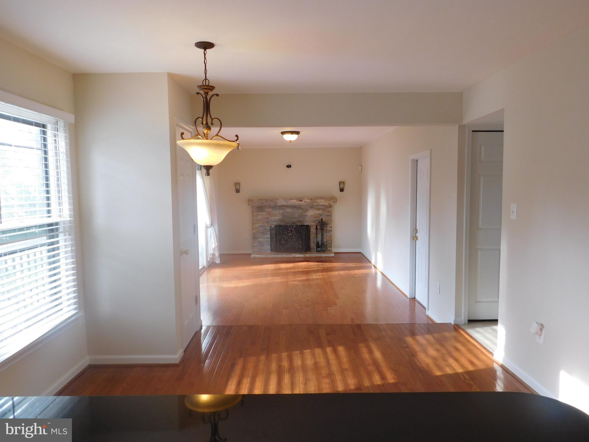 9239 Rockefeller Lane Springfield, VA 22153 - Photo 5 of 20 a room with a bed and a fireplace