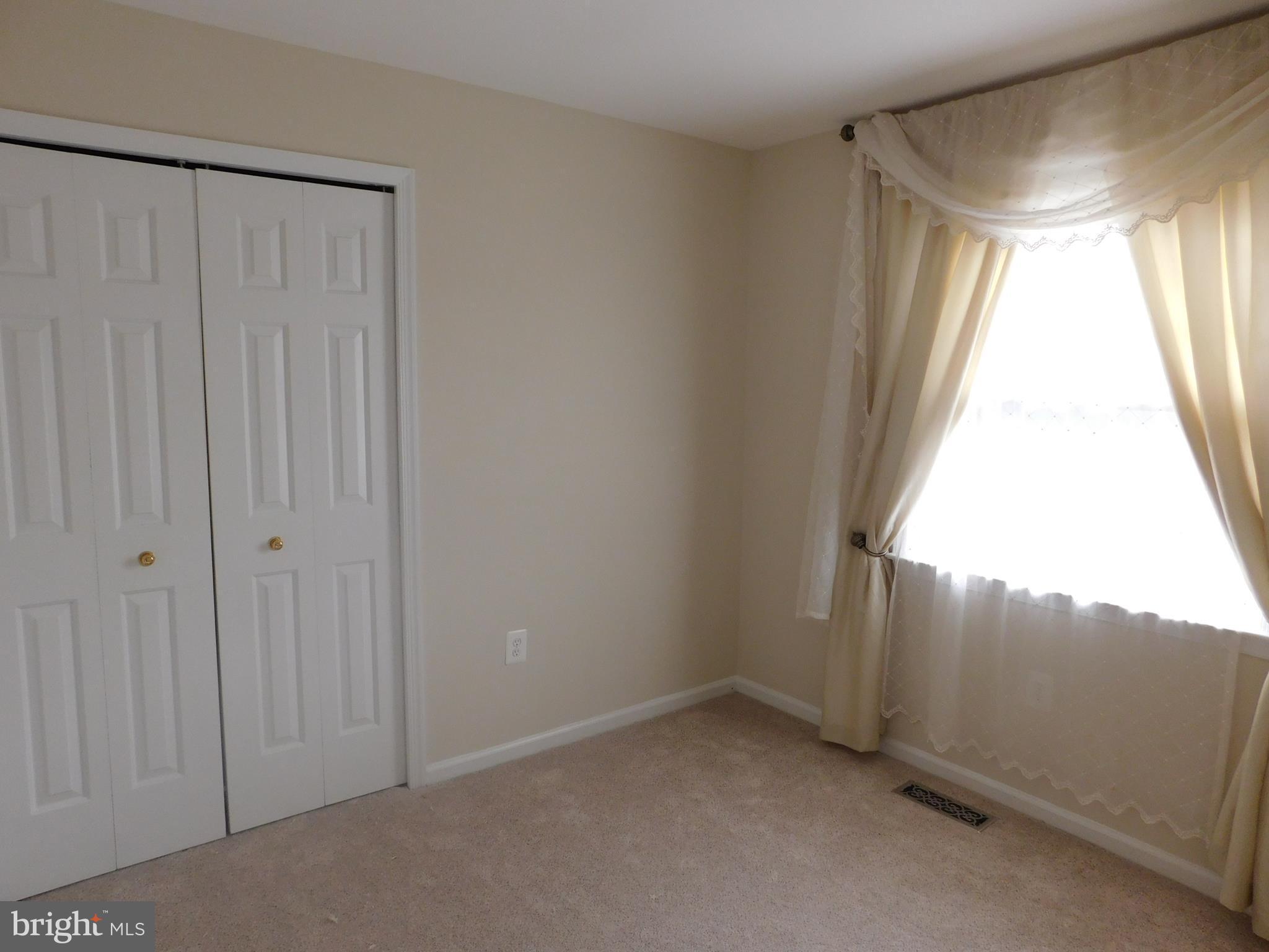 9239 Rockefeller Lane Springfield, VA 22153 - Photo 8 of 20 a view of an empty room and window
