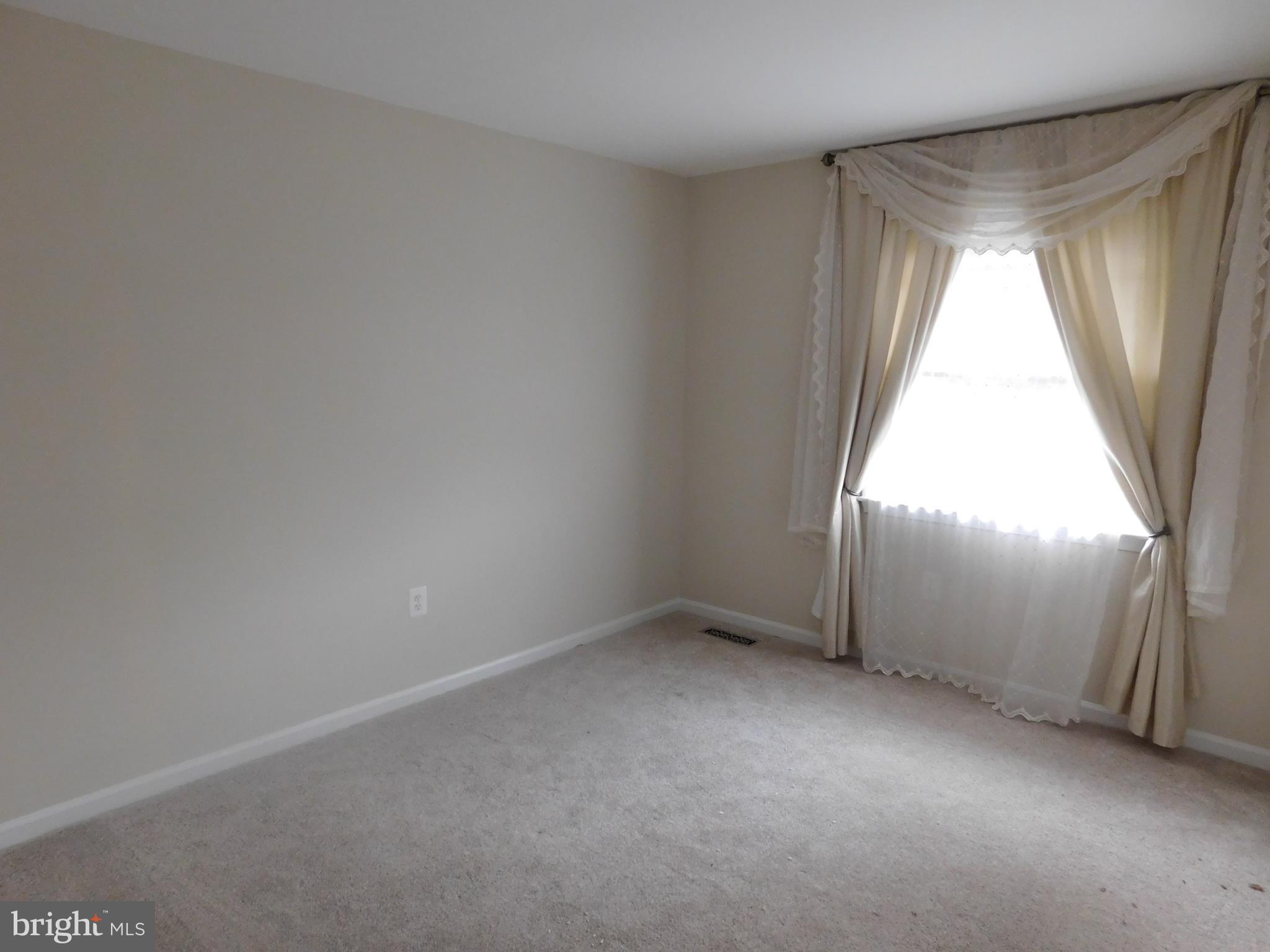 9239 Rockefeller Lane Springfield, VA 22153 - Photo 9 of 20 an empty room with a window