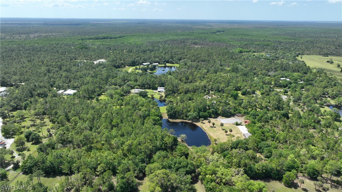 1514 Deer Run LaBelle, FL 33935 - Photo 4 of 18 an aerial view of a house with yard and outdoor seating