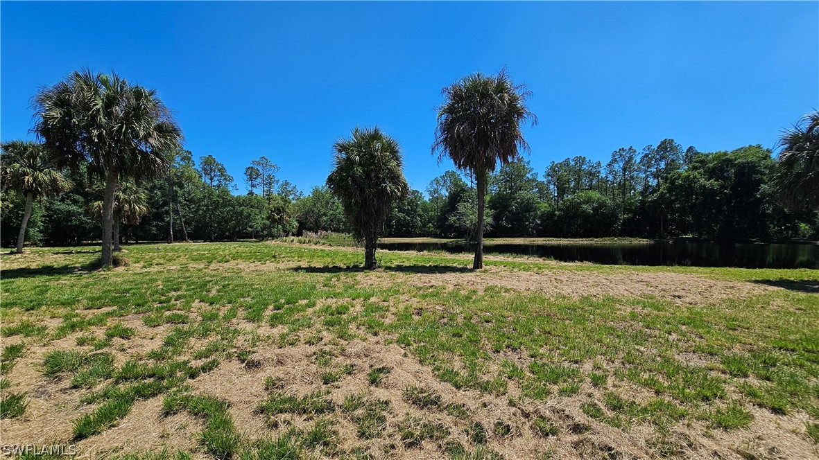 1514 Deer Run LaBelle, FL 33935 - Photo 9 of 18 a view of a yard with a trampoline