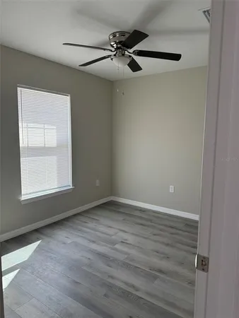 a view of an empty room with a window