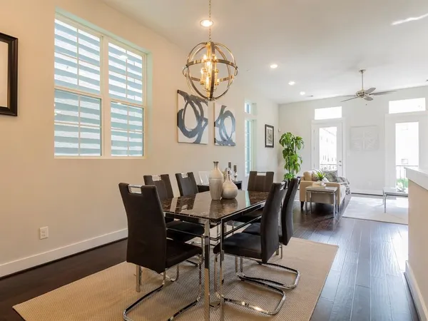 a view of a dining room with furniture window and wooden floor