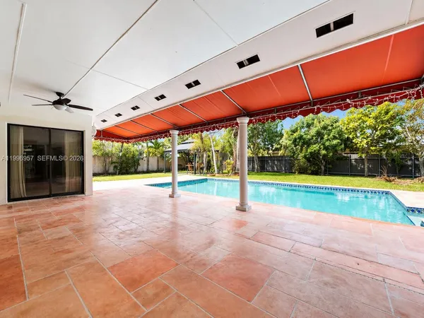 a view of a house with a yard and entertaining space