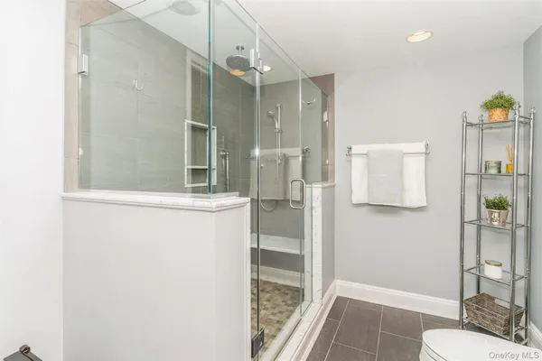 a bathroom with a shower and a sink