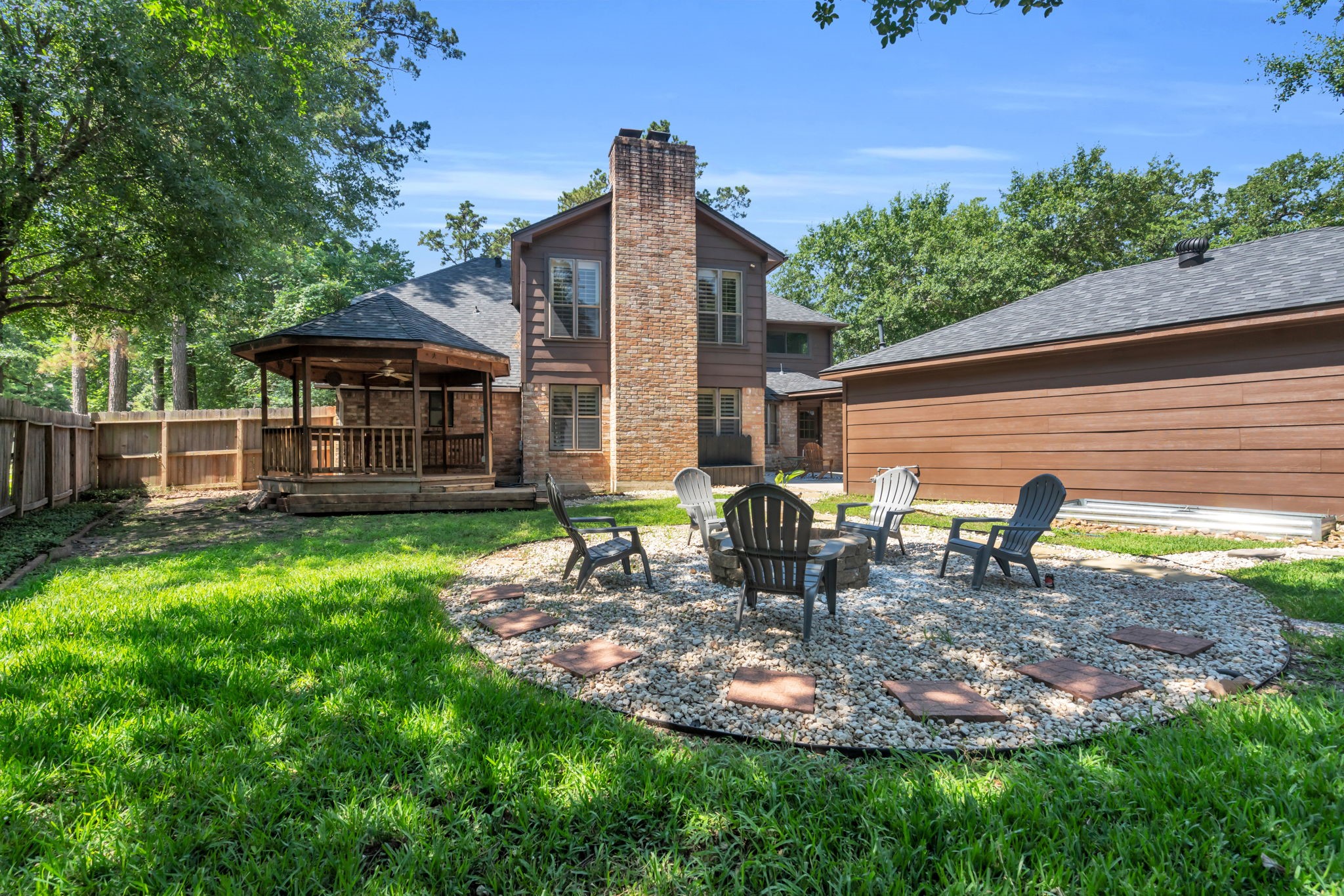 6514 Larkmount Drive Spring, TX 77389 - Photo 38 of 41 The gravel-lined fire pit area creates another cozy outdoor gathering space for S'mores and stories.