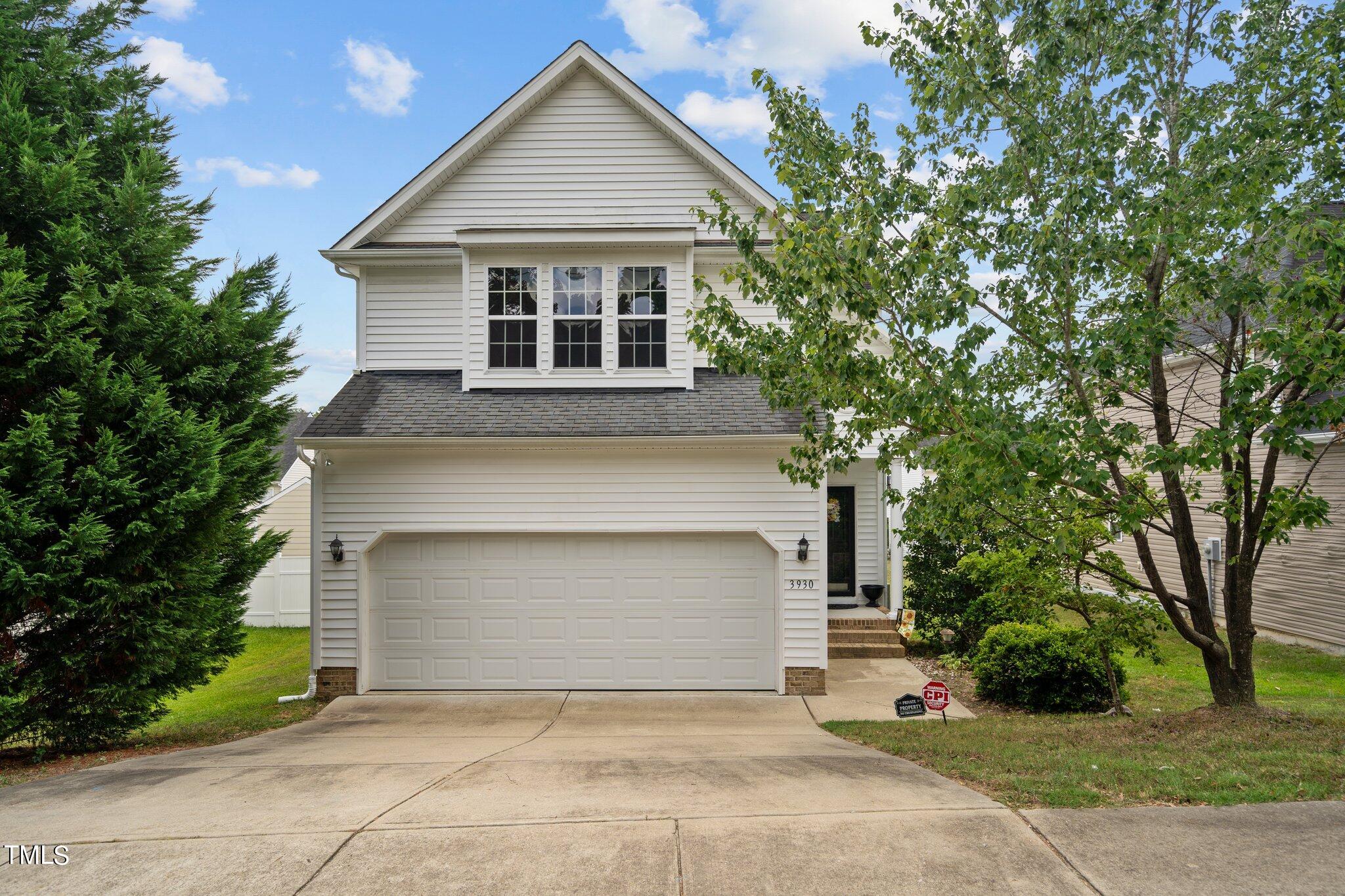 3930 Evans Drive Raleigh, NC 27610 - Photo 1 of 44 front view of a house with a garden